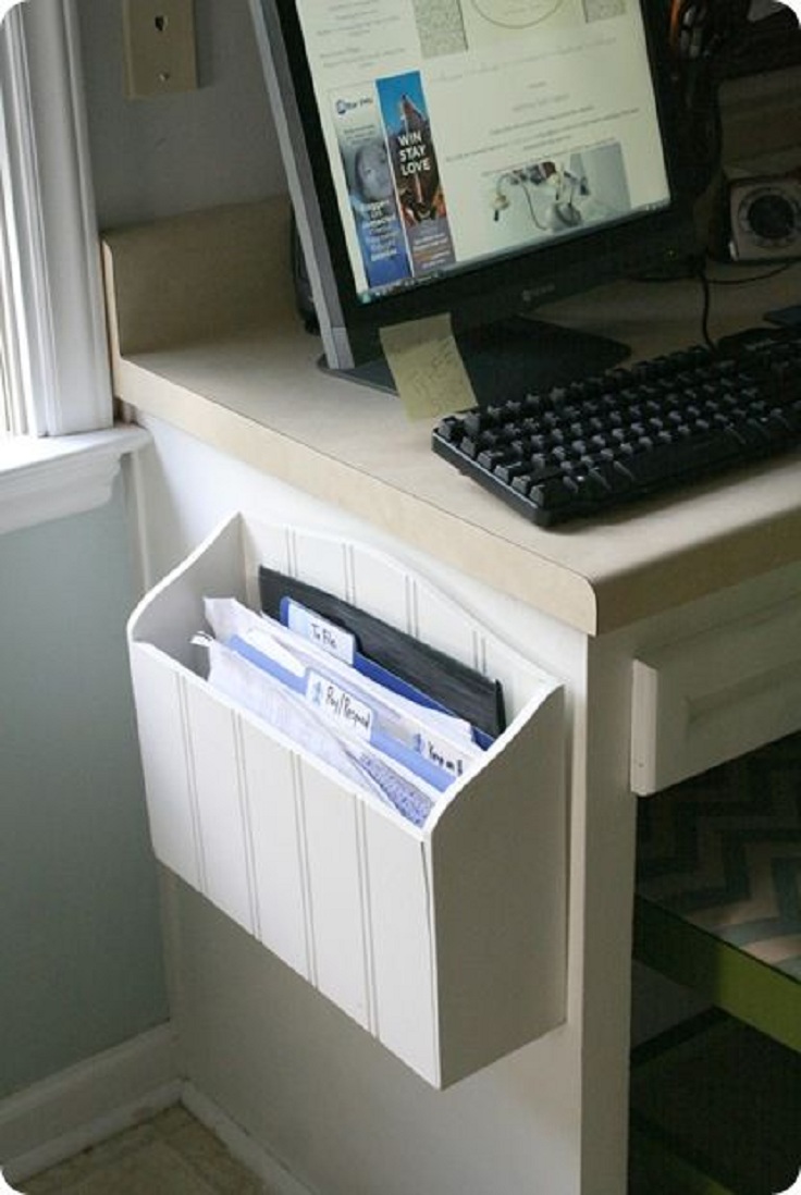 wooden-paper-holder-screwed-to-a-side-of-a-desk