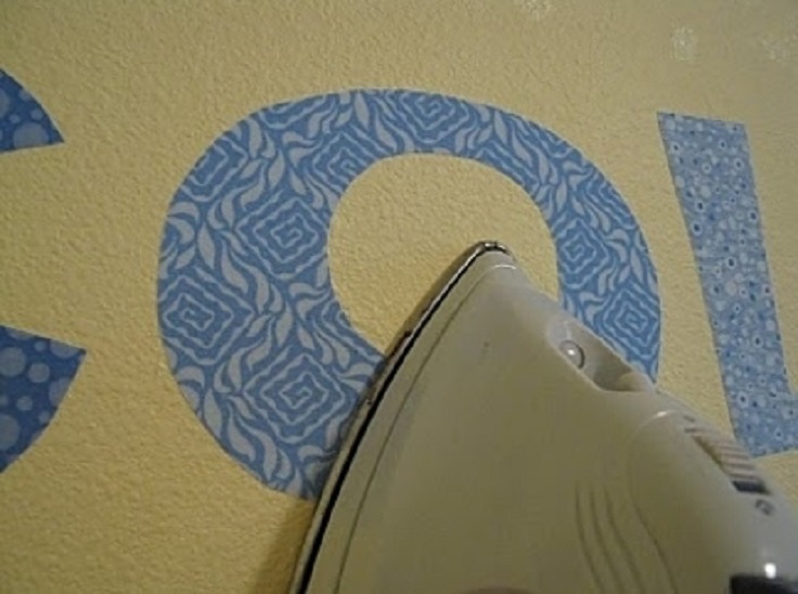 Cut-out-letters-out-of-fabric-and-iron-them-on-for-a-temporary-wall-decoration