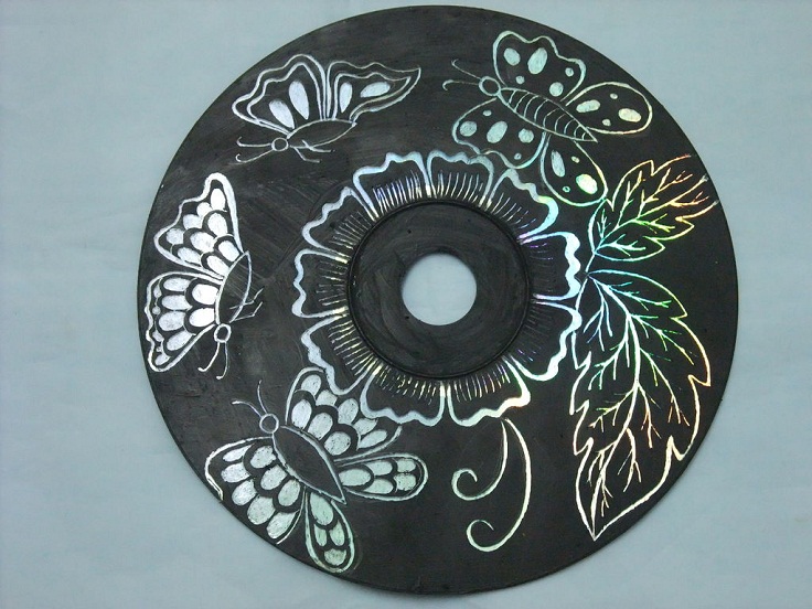 By-painting-a-CD-black-and-etching-out-a-pattern-you-can-make-beautiful-wall-art.