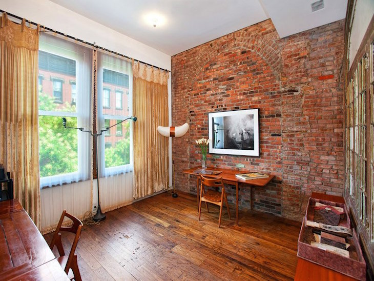 topastounding-home-interior-design-ideas-with-exposed-red-brick-wall-accent-added-with-wall-mounted-flat-television-on-laminate-parquet-flooring-plan