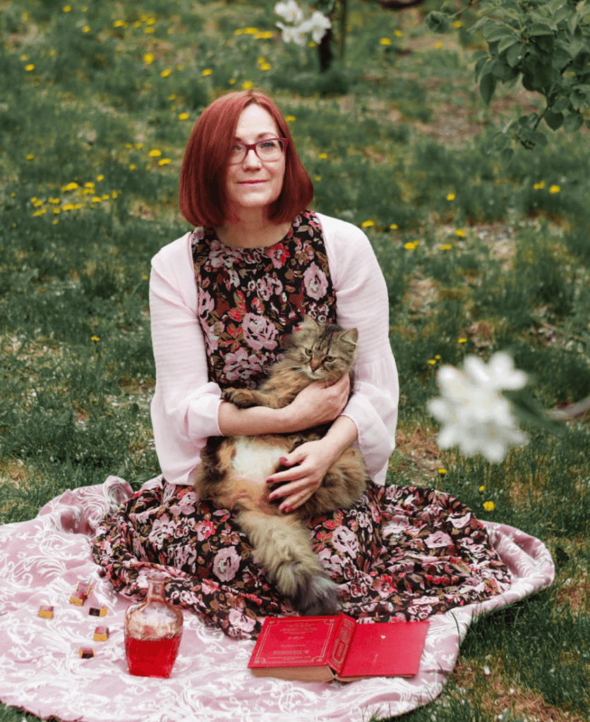 woman-holding-cat-836x1024