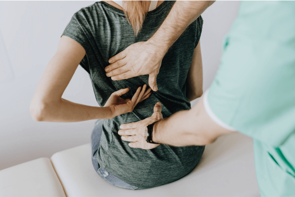 doctor-examines-woman-s-back-1024x685