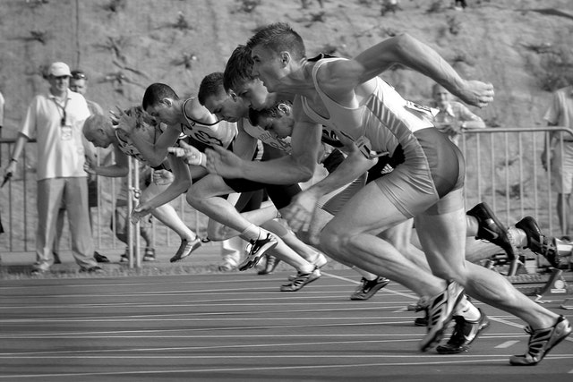 athletes running on track