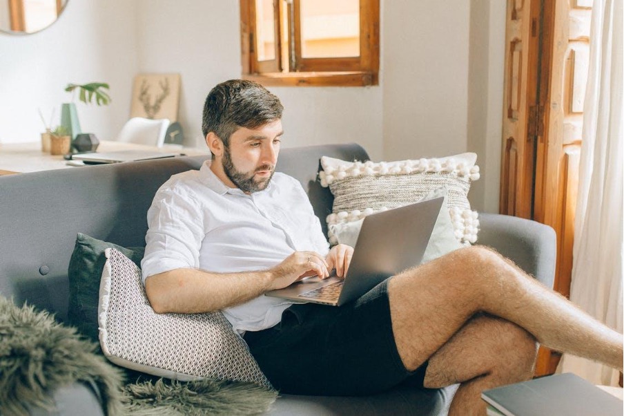 Man working on his laptop from home.