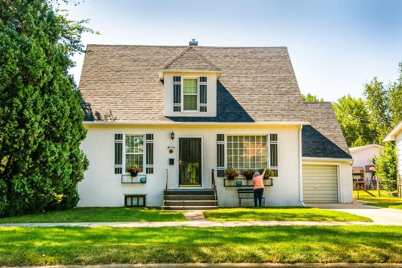 A beautiful house with slopy roofs.