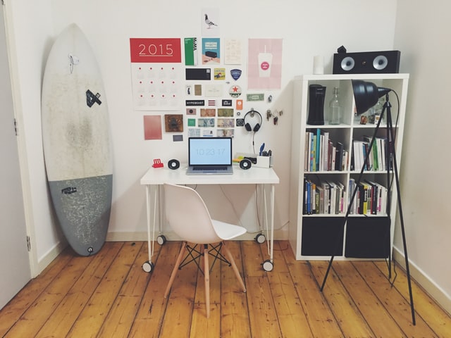 Study room with a library, study table, chair and other gadgets.