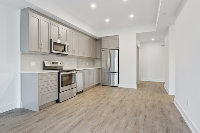 A kitchen with cabinets and flooring.