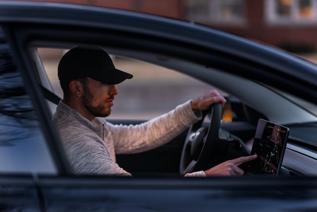 A man driving a car.