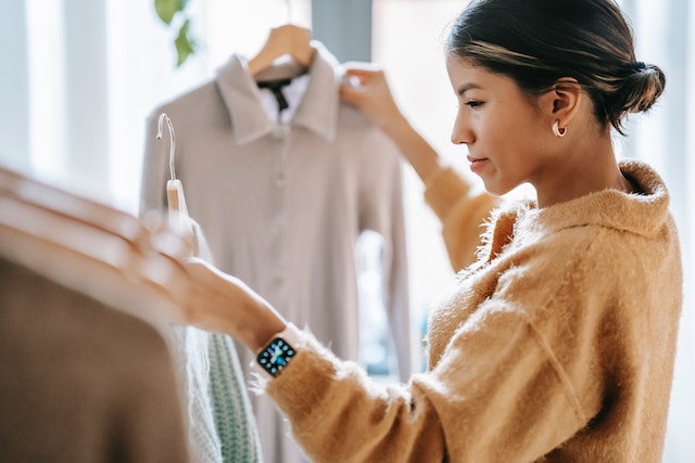 Woman looking at clothes.