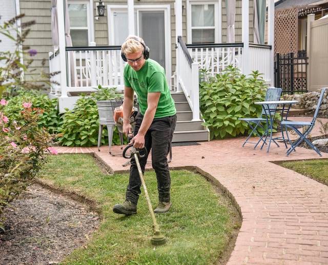 man doing lawn care